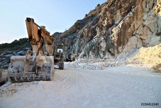 Picture of Apuan Alps Carrara Tuscany Italy An excavator in a quarry of white Carrara marble In the mountains of the Apuan Alps above the city of Carrara white marble has been mined since Roman times 